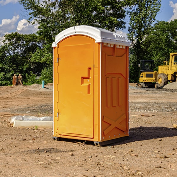 what is the cost difference between standard and deluxe portable restroom rentals in Baldwin